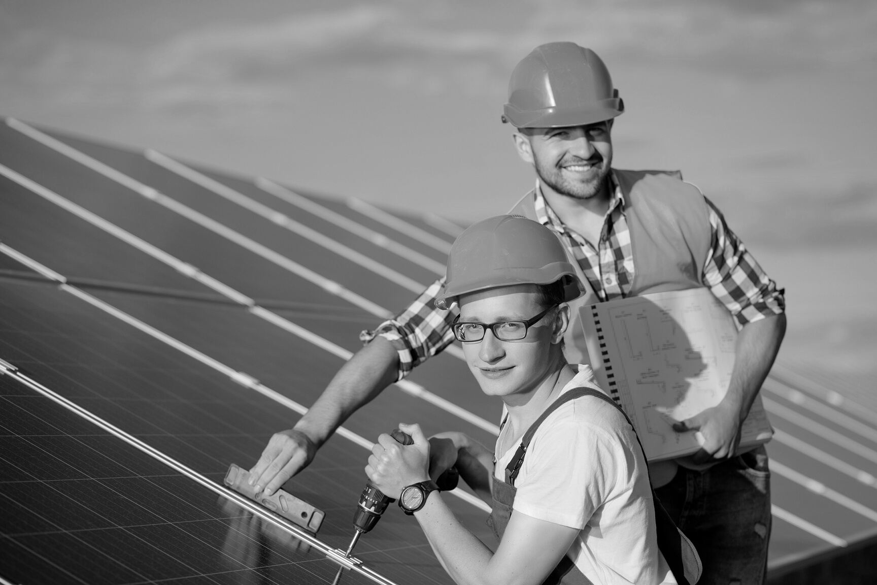 Engineers installing solar panels.